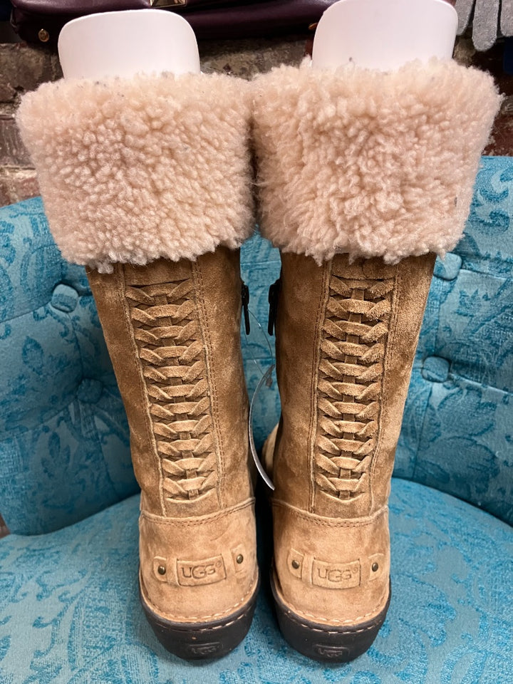 Brown ugg boot, 7